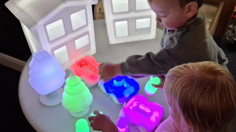 website babies playing with light toys